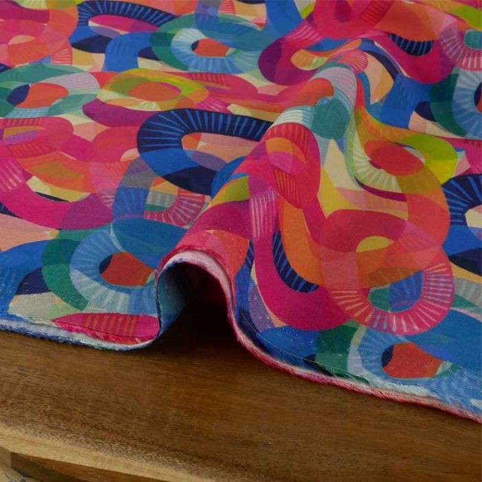 Tissu viscose motifs anneaux colorés - multicolore x 10 cm