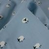 Tissu popeline coton motifs moutons - bleu ciel x 10cm