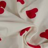 Tissu jersey sweat léger coeurs rouges - blanc x 10 cm