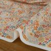 Tissu imperméable souple fleurs - orange x 10 cm