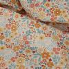 Tissu imperméable souple fleurs - orange x 10 cm